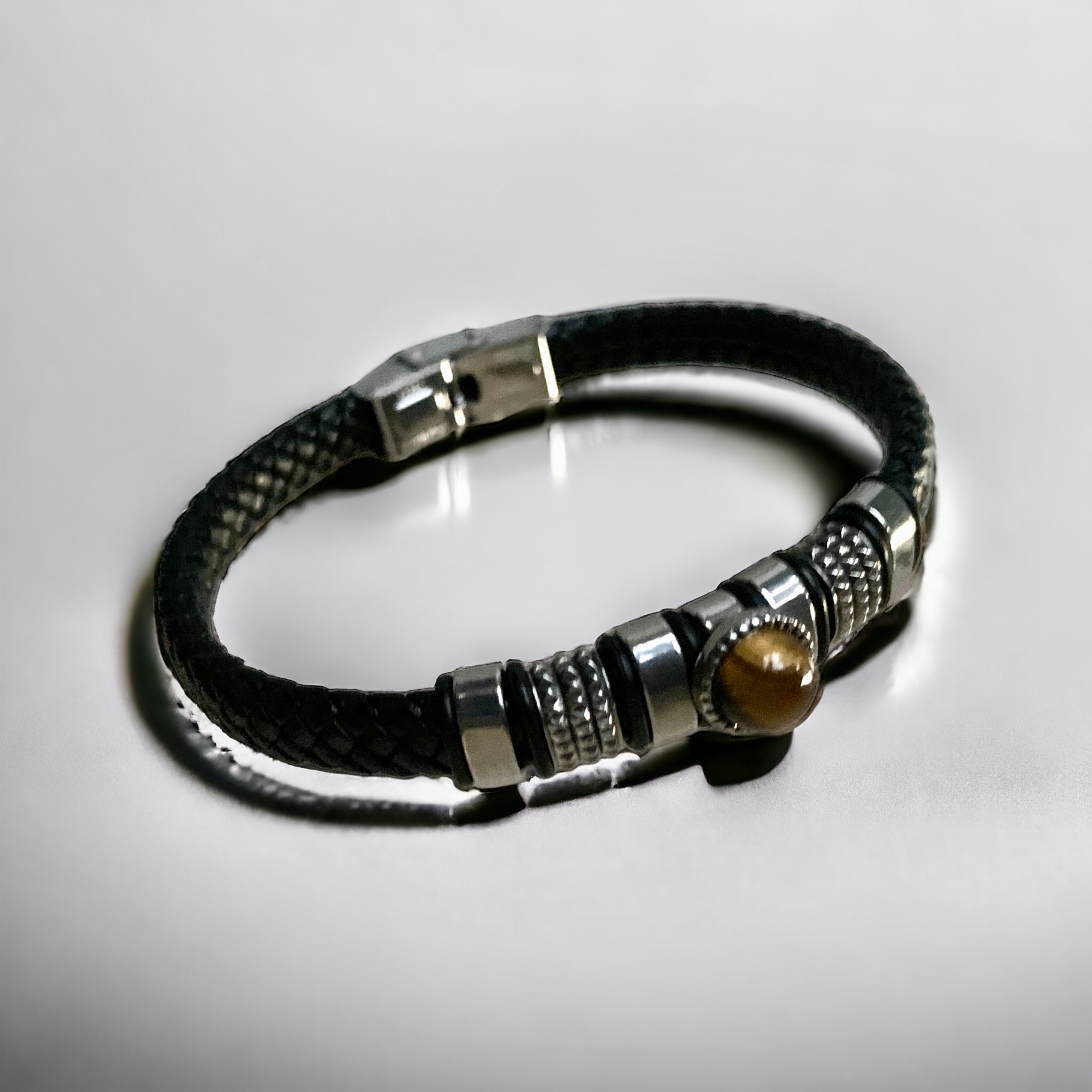 Bracelet Cuir tressé noir, Pierre Oeil de tigre Acier.